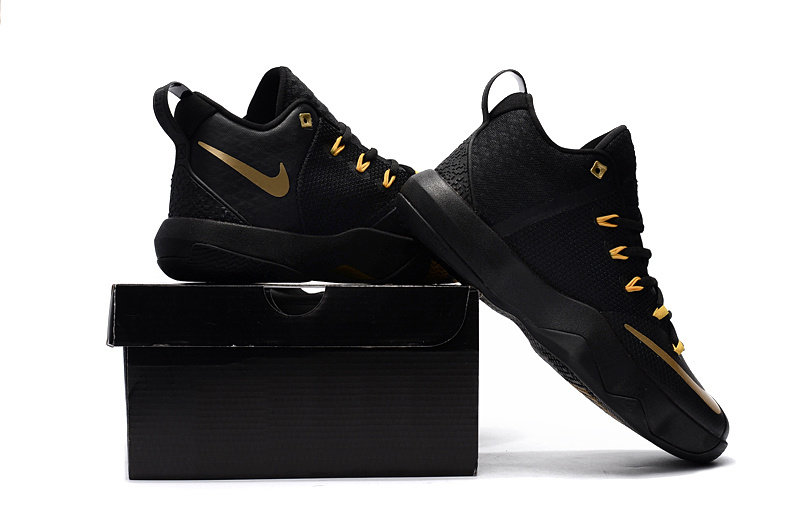 nike black gold shoes